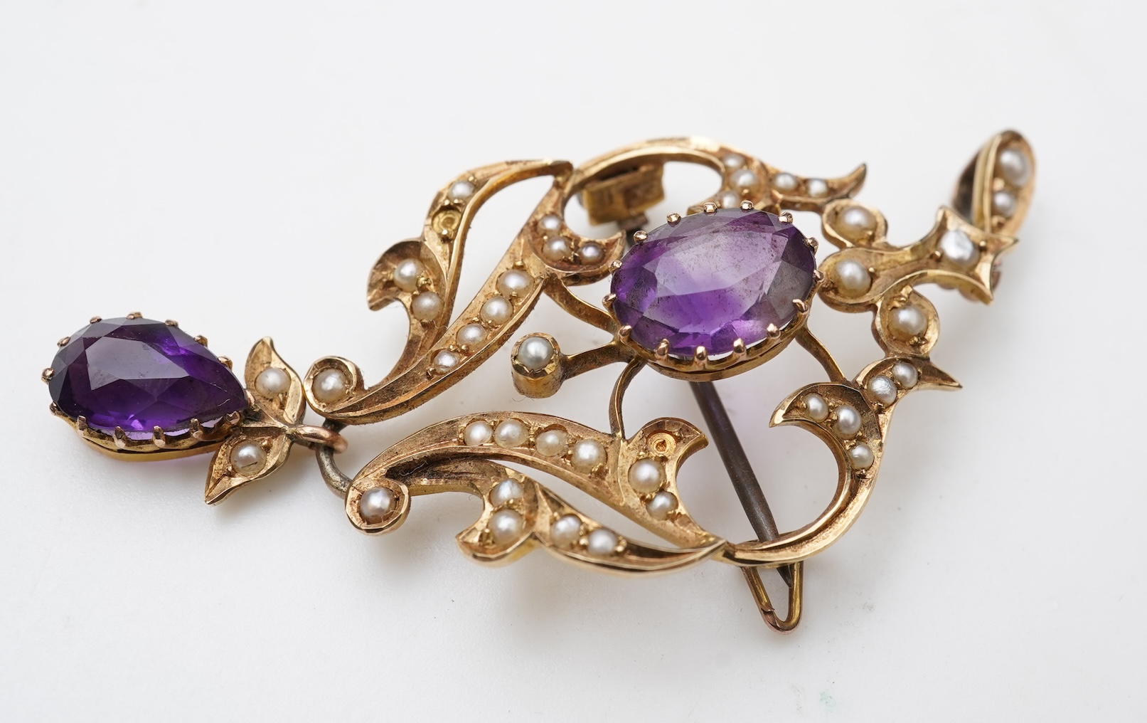 An Edwardian amethyst and seed pearl pendant and bar brooch, early 20th century